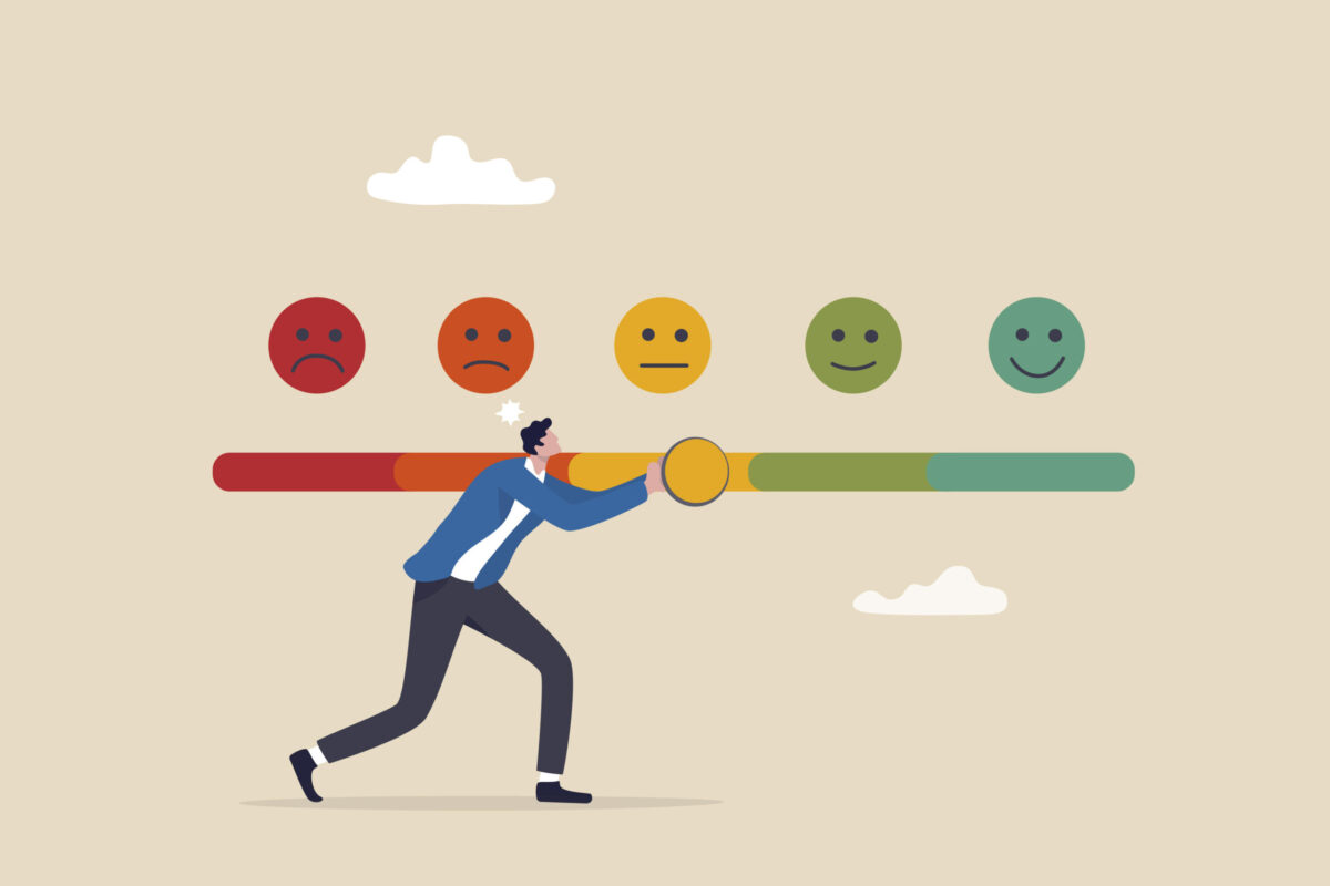 illustration-bien-etre-travail-CR-iStock Illustration d'un homme en veston bleu qui tient une barre graduée du rouge au vert. Au-dessus de la barre figurent cinq cercles qui montrent des expressions différentes, allant de la grimace à gauche au grand sourire à droite.